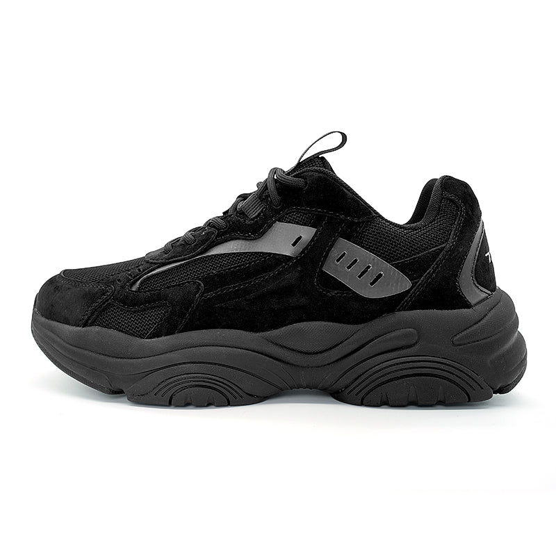 A pair of all - black chunky sneakers with a thick sole and a combination of materials, featuring a small blue accent, suitable for casual and trendy wear.

