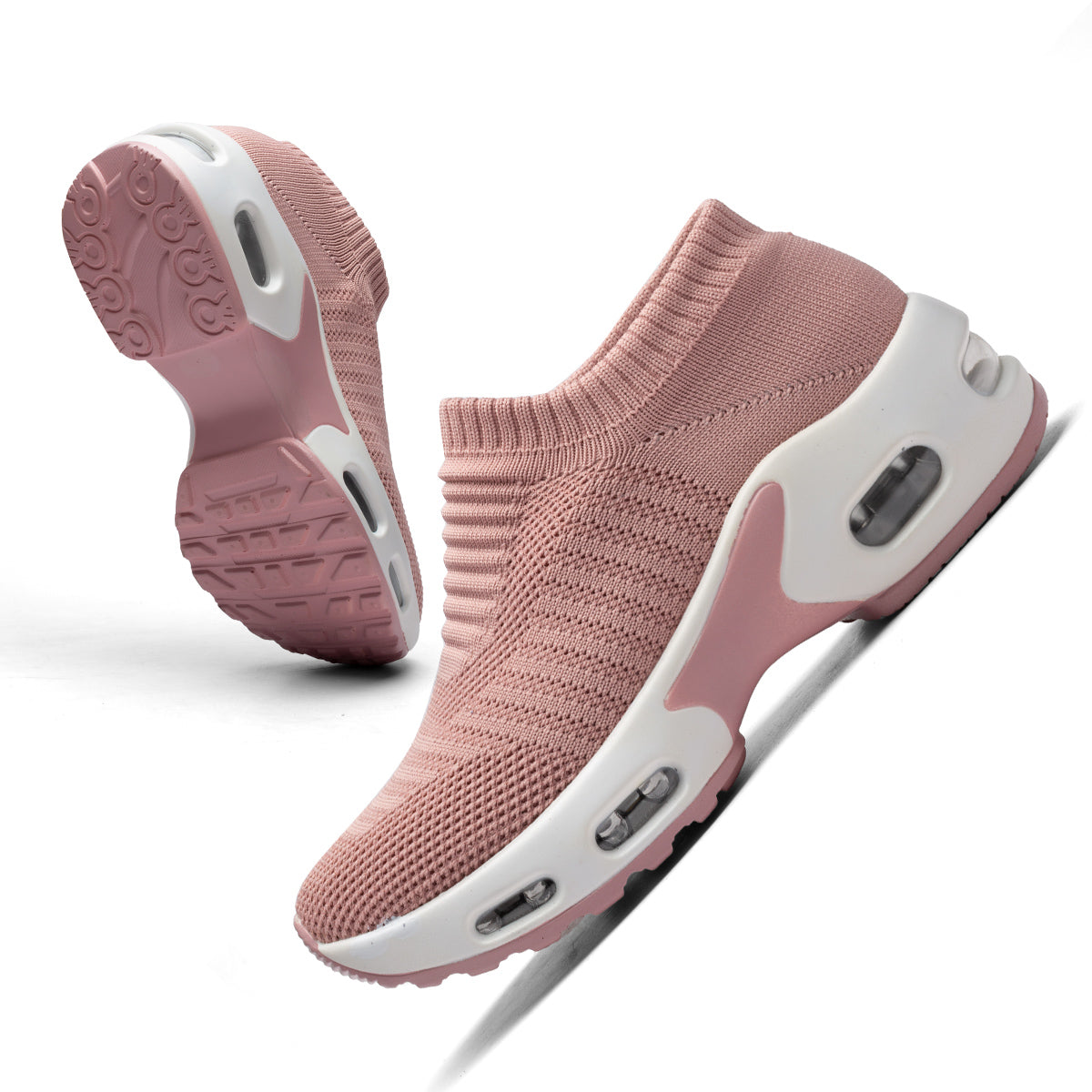 Pink slip-on sneakers with white soles on a white background